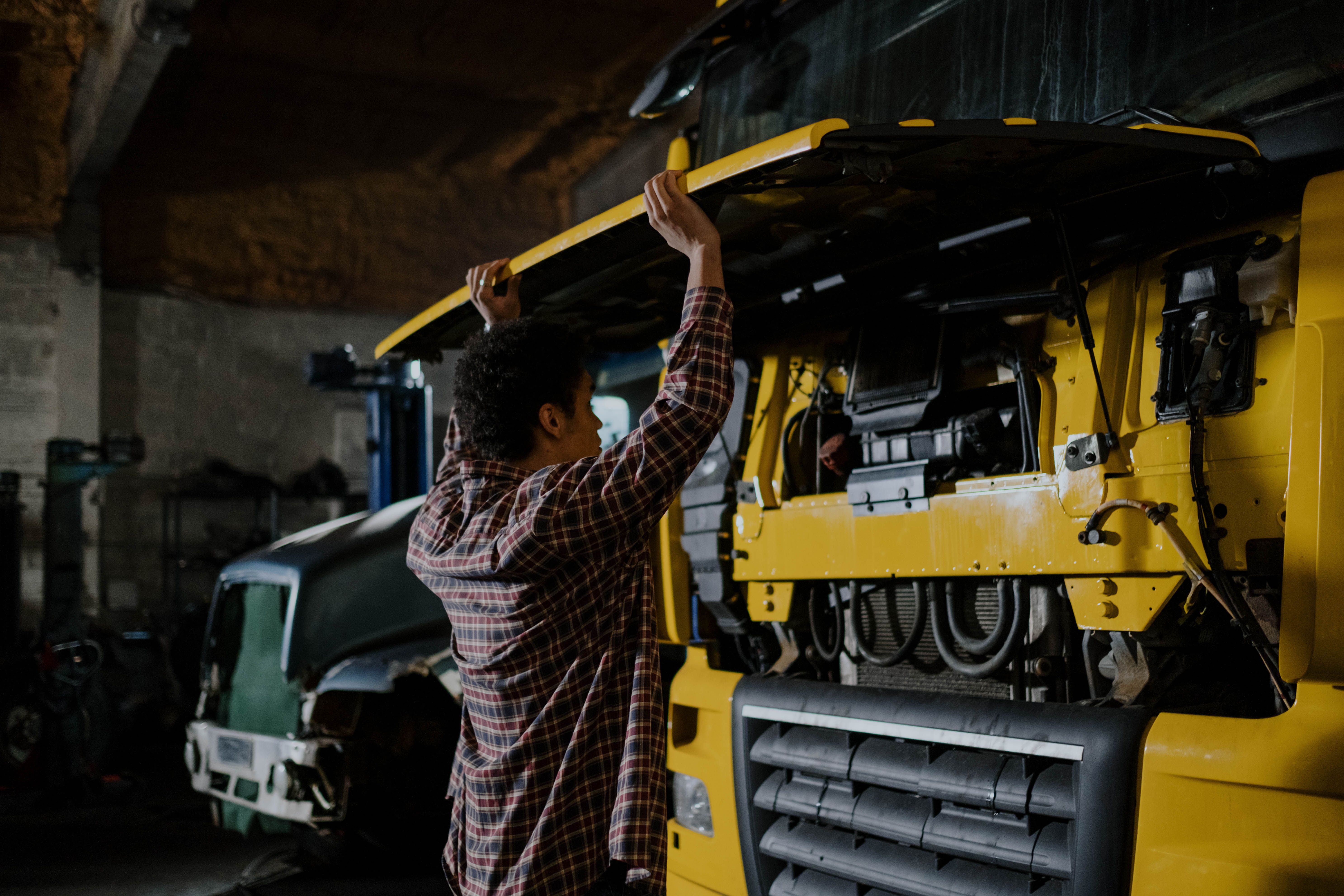 Mechanic working on truck engine
